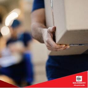 man carrying boxes for shipping