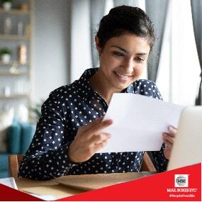 woman reading a newsletter